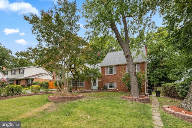 view of front of house featuring central AC and a front yard