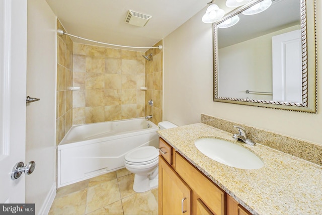 full bathroom featuring tiled shower / bath, vanity, toilet, and tile patterned floors