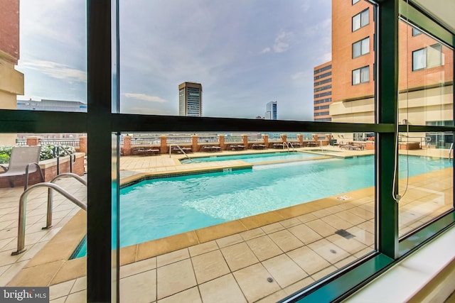 view of swimming pool with a jacuzzi