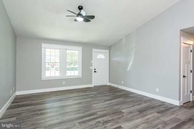 foyer featuring ceiling fan and dark hardwood / wood-style floors