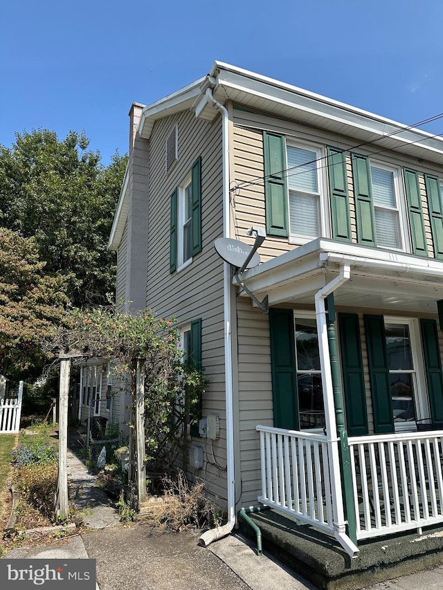 view of property featuring a porch