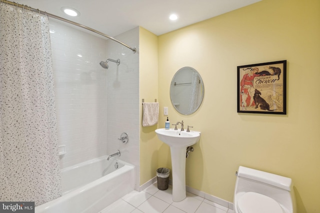 bathroom featuring toilet, shower / bath combo, and tile patterned floors