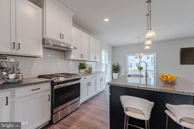 living room with light hardwood / wood-style flooring and sink