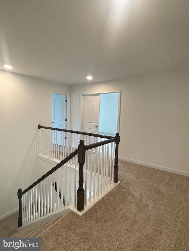 hallway featuring carpet