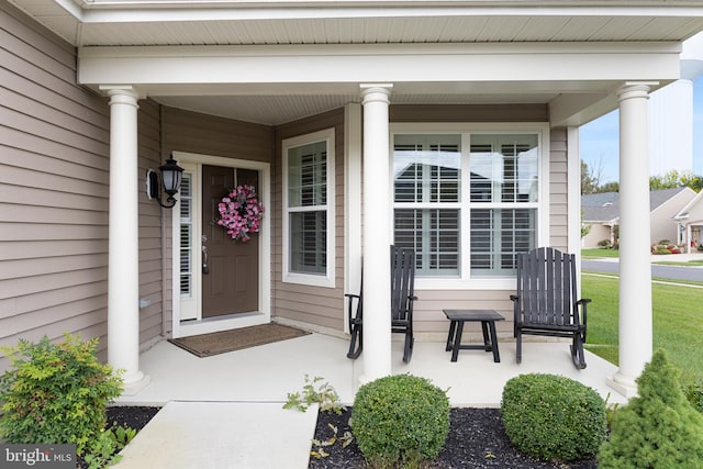 property entrance featuring covered porch