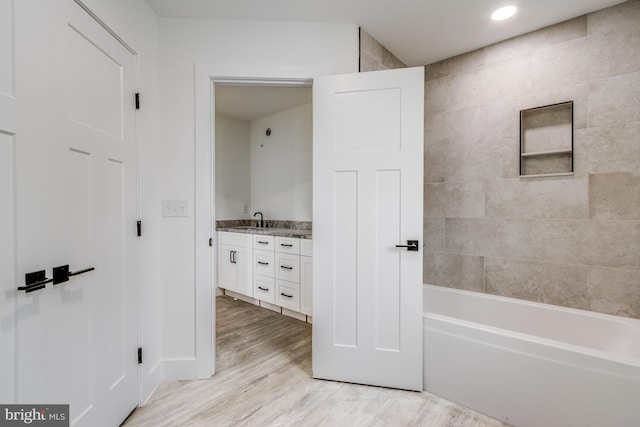 bathroom featuring vanity and wood-type flooring