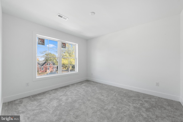 empty room with carpet flooring