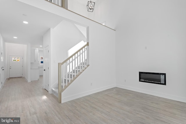 unfurnished living room featuring light hardwood / wood-style flooring