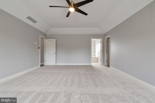 unfurnished room featuring ceiling fan, light carpet, and vaulted ceiling