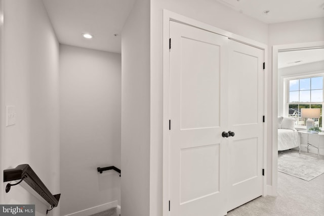 corridor featuring recessed lighting, carpet, and baseboards