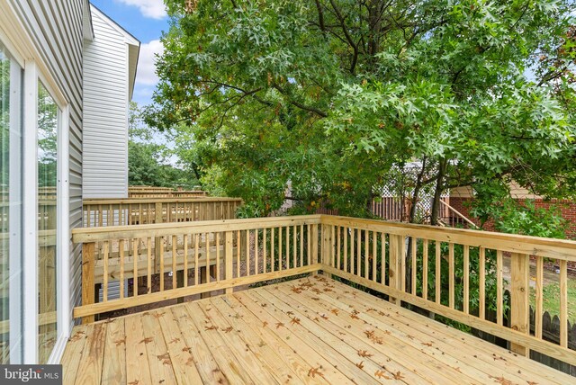 wooden deck featuring fence