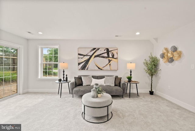 living area with light colored carpet