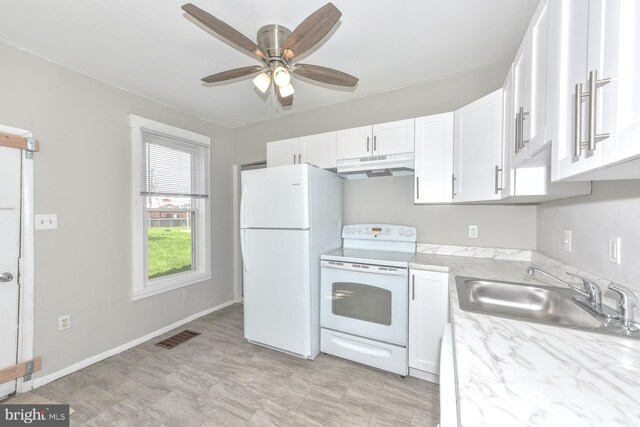 kitchen with white appliances, sink, ceiling fan, and white cabinets