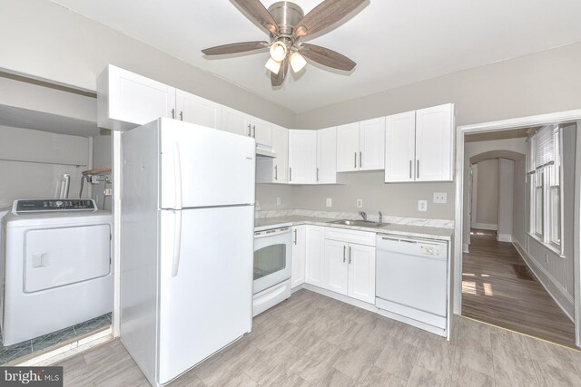 kitchen with washer / clothes dryer, white cabinets, white appliances, ceiling fan, and sink