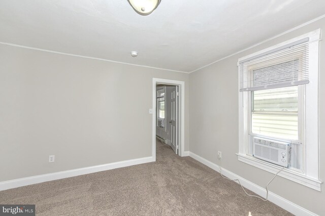 carpeted empty room with ornamental molding