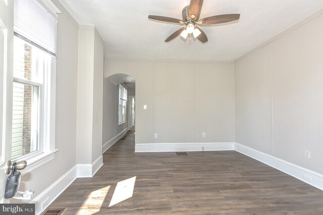 empty room featuring ceiling fan and dark hardwood / wood-style floors