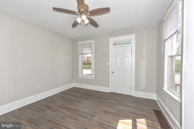 interior space featuring ceiling fan and dark wood-type flooring