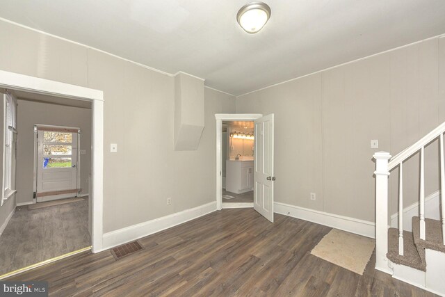 empty room featuring dark wood-type flooring