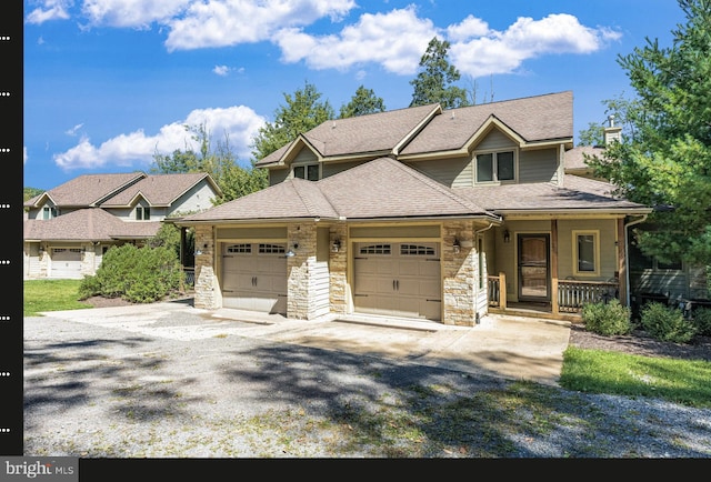 view of front of property with a garage and covered porch