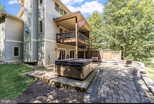 exterior space with a hot tub and area for grilling