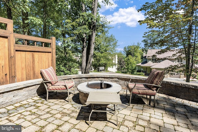 view of patio / terrace featuring a fire pit