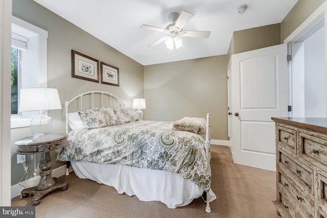 bedroom with ceiling fan and carpet floors