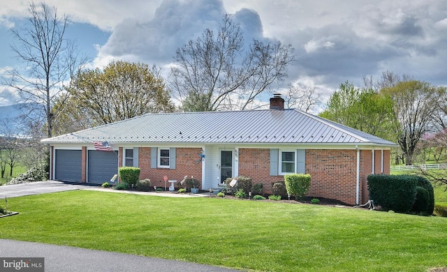 single story home featuring a garage and a front lawn