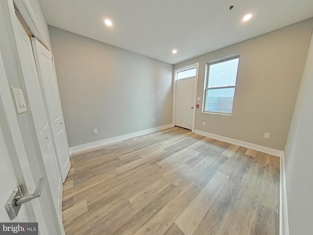 unfurnished bedroom with light wood-type flooring