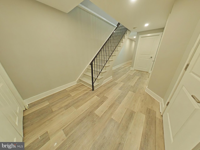 staircase featuring hardwood / wood-style floors