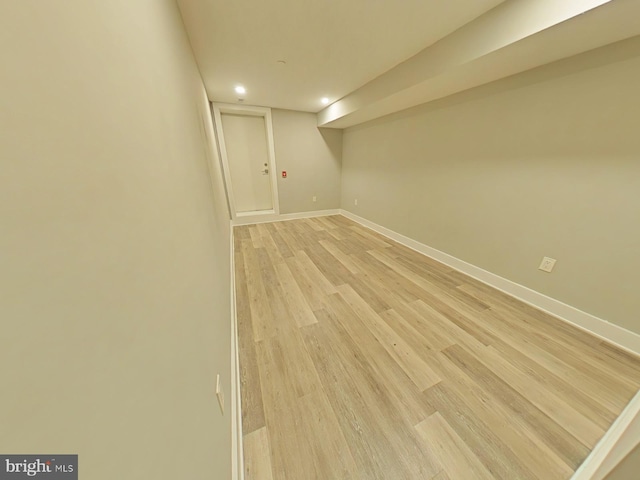 basement featuring light wood-type flooring