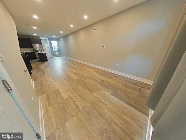 unfurnished living room featuring hardwood / wood-style floors