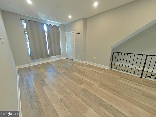 spare room with light hardwood / wood-style flooring