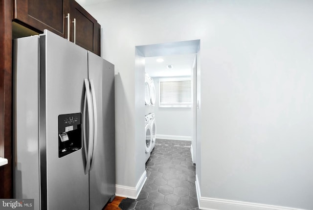 kitchen featuring tile patterned flooring, dark brown cabinetry, and stainless steel refrigerator with ice dispenser