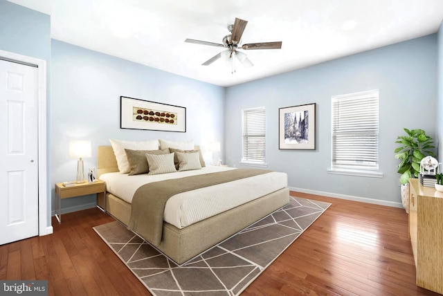 bedroom featuring ceiling fan and dark hardwood / wood-style floors