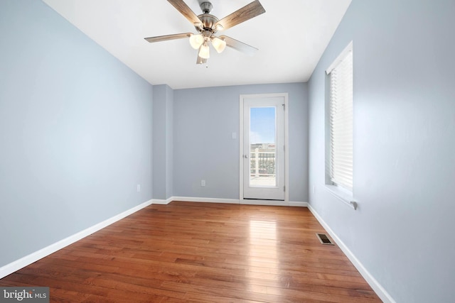 unfurnished room with wood-type flooring and ceiling fan