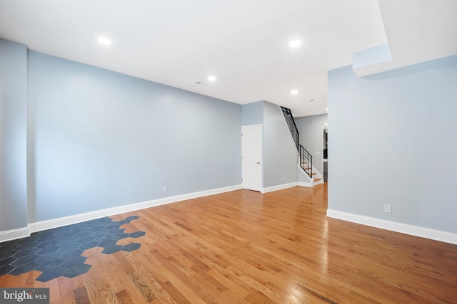 basement featuring dark hardwood / wood-style floors