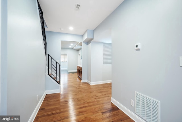 hall with light hardwood / wood-style flooring