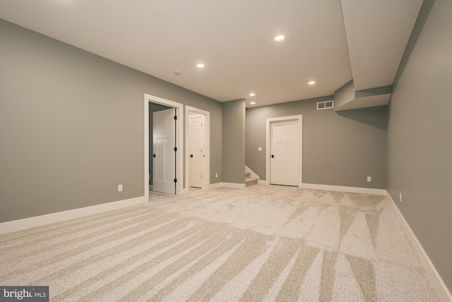 interior space featuring light carpet