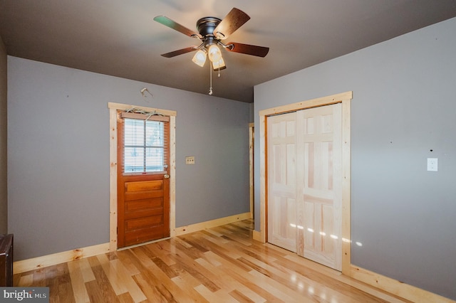 interior space with ceiling fan, light hardwood / wood-style floors, and a closet