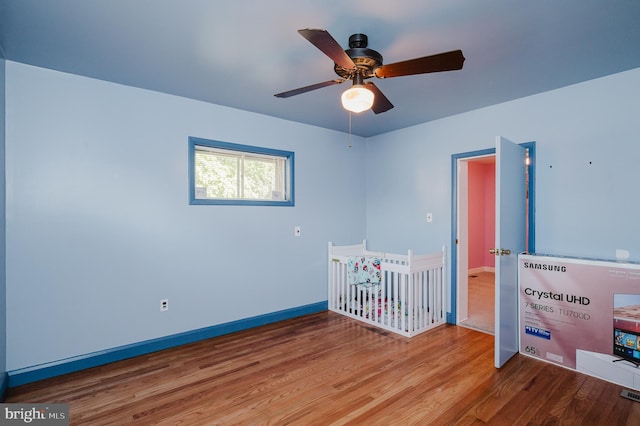 unfurnished bedroom featuring ceiling fan and wood-type flooring