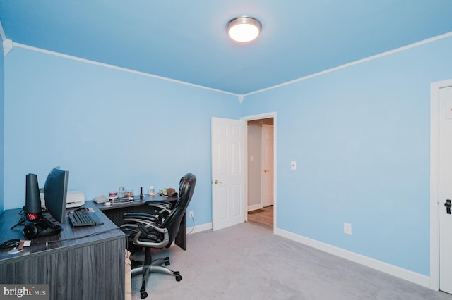 carpeted home office with ornamental molding