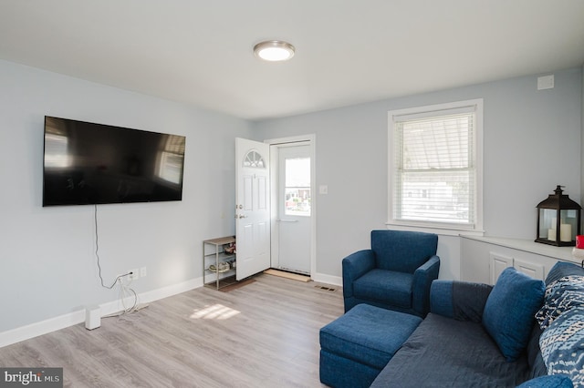 living room with light hardwood / wood-style floors