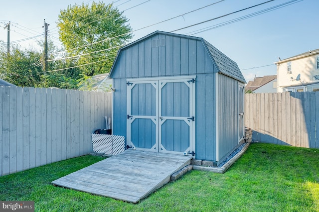 view of outdoor structure with a lawn