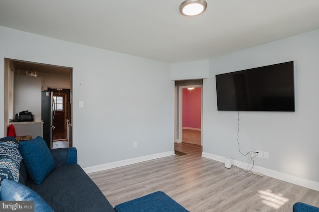 living room with light hardwood / wood-style floors