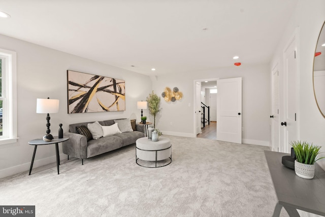 living room with light colored carpet