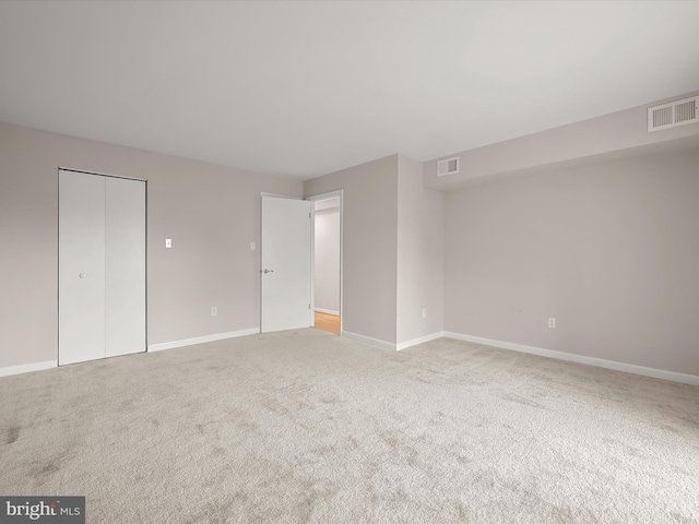 unfurnished room featuring carpet