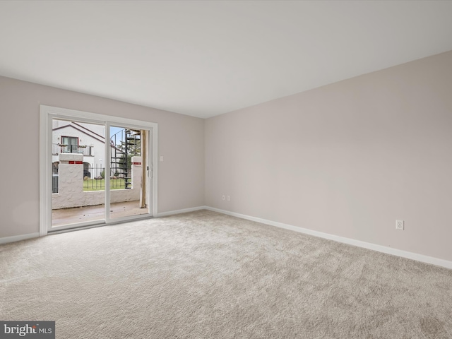 unfurnished room featuring carpet