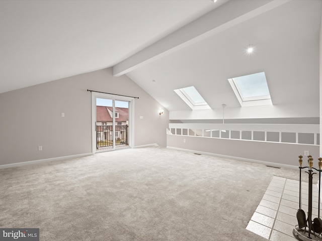 bonus room featuring carpet flooring and vaulted ceiling with skylight