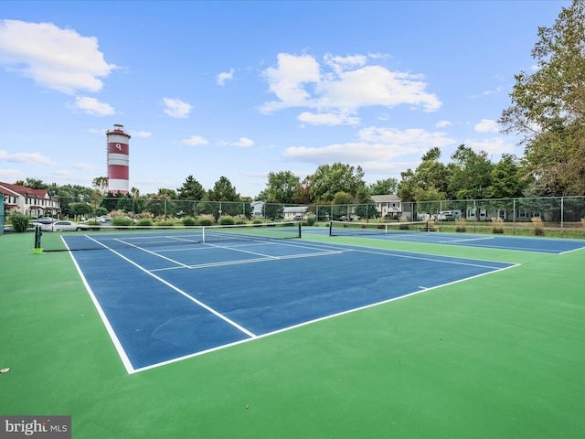 view of tennis court featuring basketball court