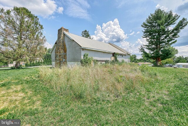 view of home's exterior featuring a lawn